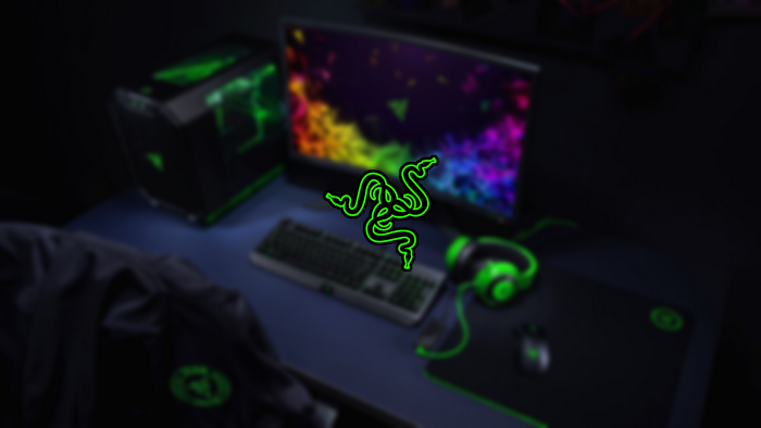 Razer PC gaming setup with computer, monitor, keyboard, mouse, and headphones