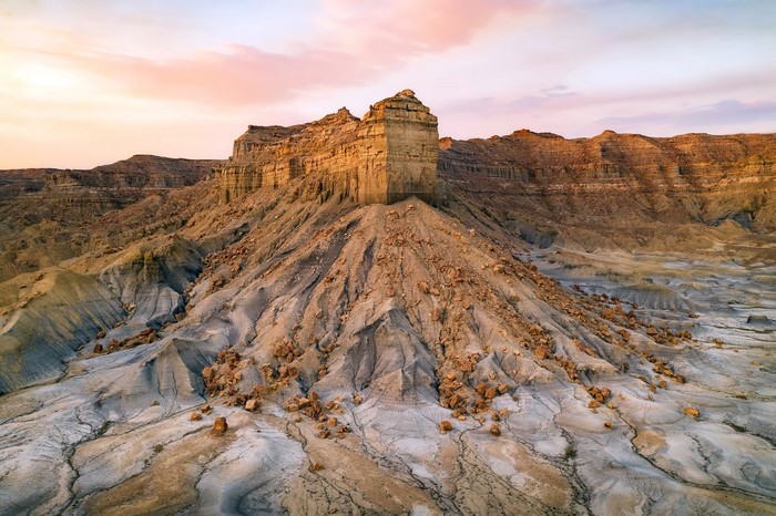 Desert landscape with rock formations at sunset