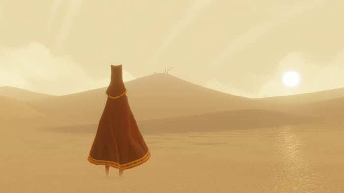 Figure in a red cloak in a desert in Journey