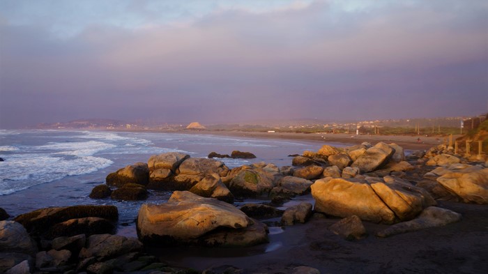 4K sea with rocks and waves at sunset