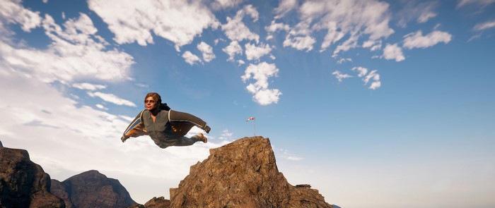 Far Cry 5 wingsuit flyer over mountains