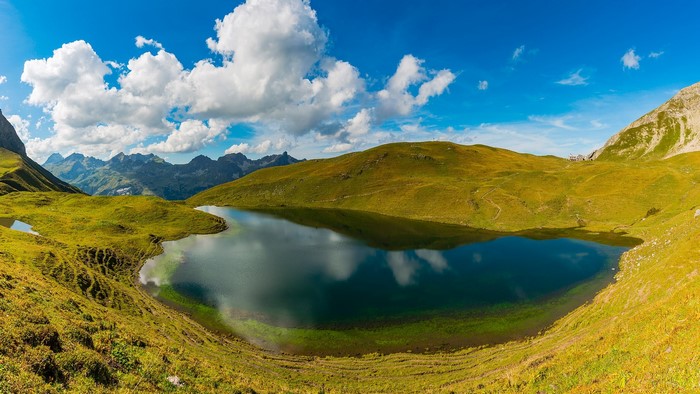 Lake Rappensee with mountains and clouds in Bavaria, Germany