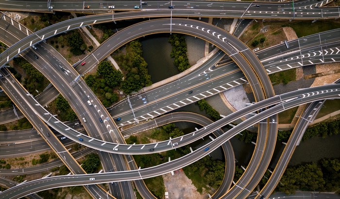 Aerial view of a complex highway interchange with cars