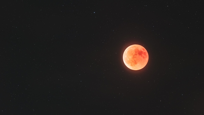 Red Moon in a Starry Night Sky 4K