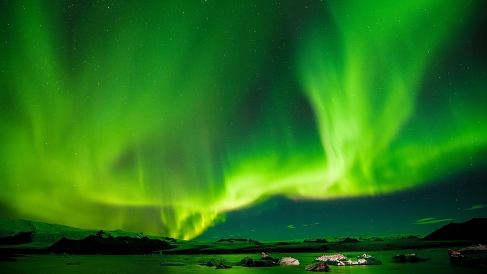 Aurora Borealis over a glacial lagoon