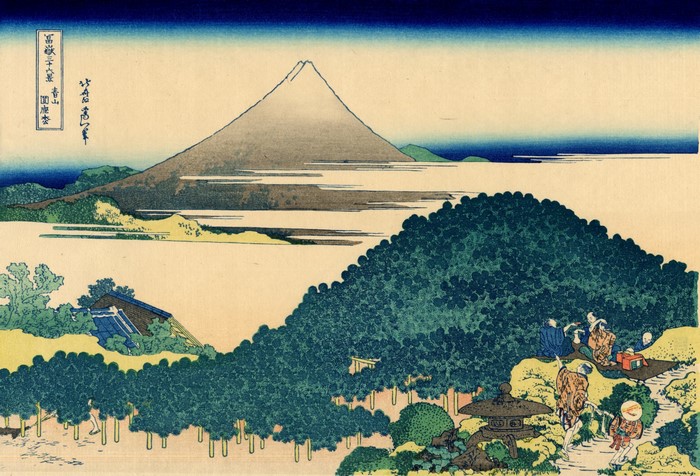 Mount Fuji from a distance with people walking on a path