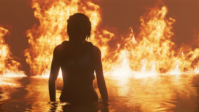 Lara Croft in Shadow of the Tomb Raider surrounded by fire