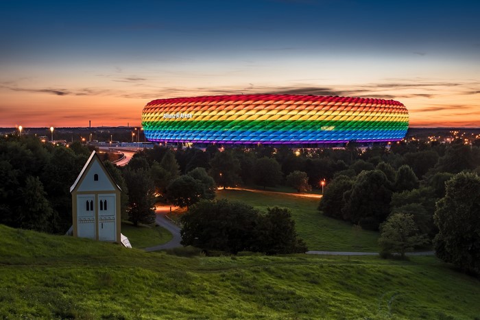 Allianz Arena in Munich illuminated with rainbow colors at sunset