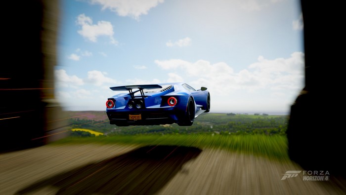 Blue Ford GT Mk II jumping in Forza Horizon 4