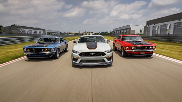 Ford Mustang Mach 1 cars on a racetrack