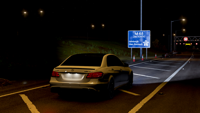 Mercedes AMG E63 on M68 highway at night