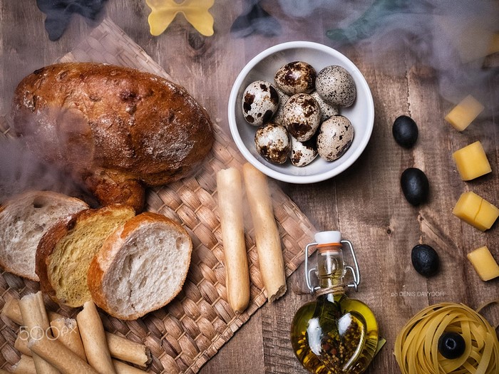Bread, olives, eggs, and pasta with olive oil