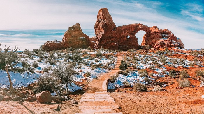 Turret Arch and Path in Arches National Park with Snow