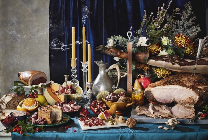 Still life with food, fruit, and candles