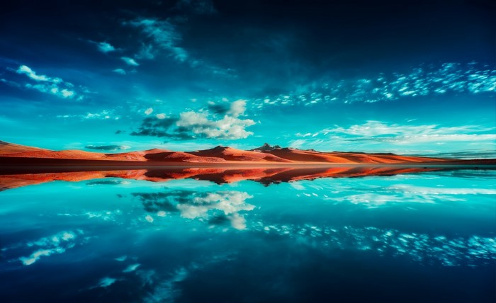Desert landscape with lake and sky reflection