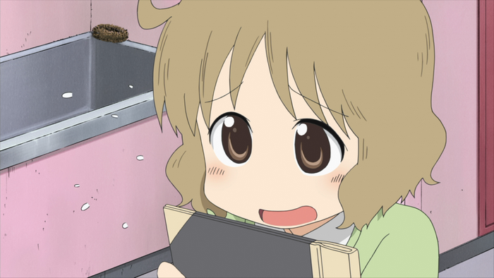 Yuko Aioi from Nichijou holding a book
