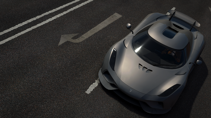 Silver Koenigsegg Hypercar on Asphalt Road