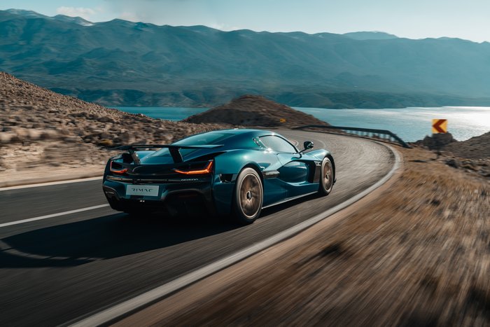 Rimac Nevera electric supercar driving on a coastal road