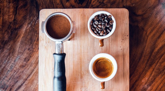 Espresso preparation with coffee beans and grounds