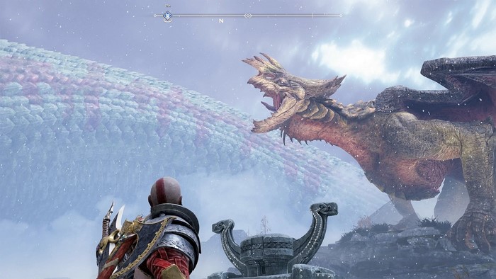 Kratos facing a dragon in God of War