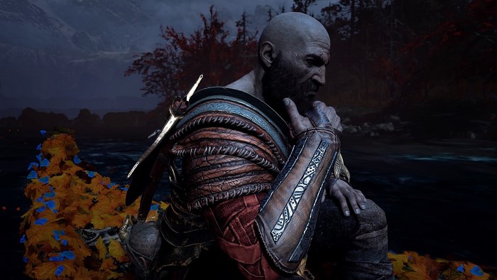 Kratos from God of War sitting by a river