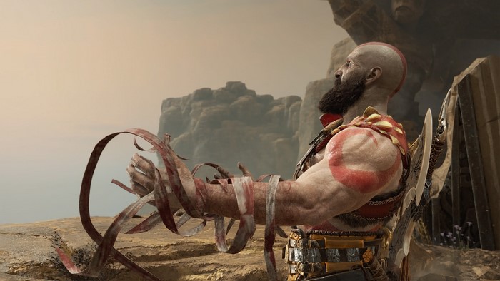 Kratos from God of War with his arms bound