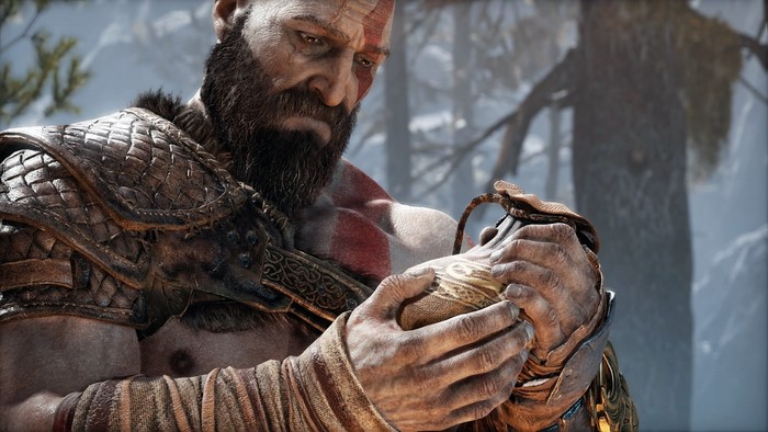 Kratos from God of War holding a pouch
