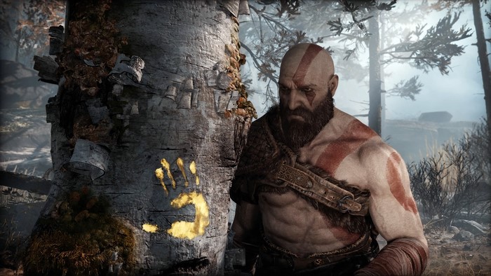 Kratos from God of War (2018) next to a tree