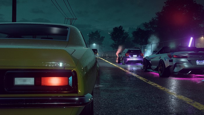 Cars racing at night in Need for Speed