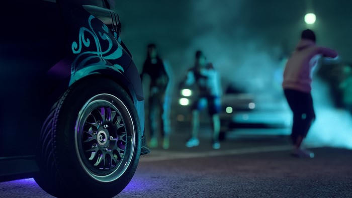 Car with cyan design in Need for Speed street race at night