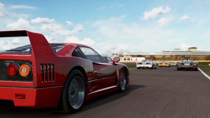 Ferrari F40 and other race cars on a track