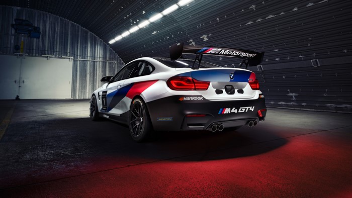 BMW M4 GT4 race car in a hangar