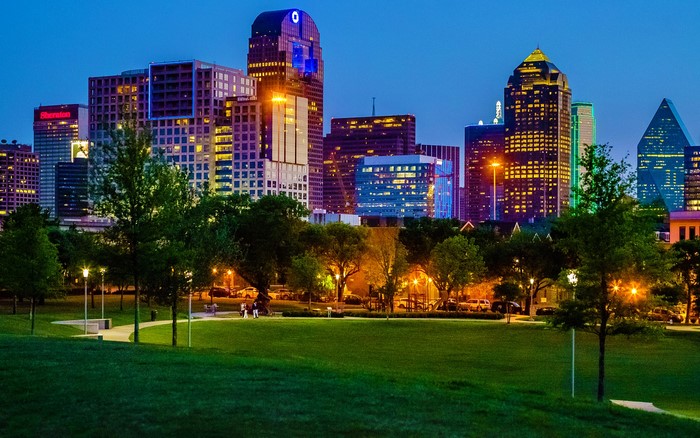 Dallas skyline at dusk with park in foreground