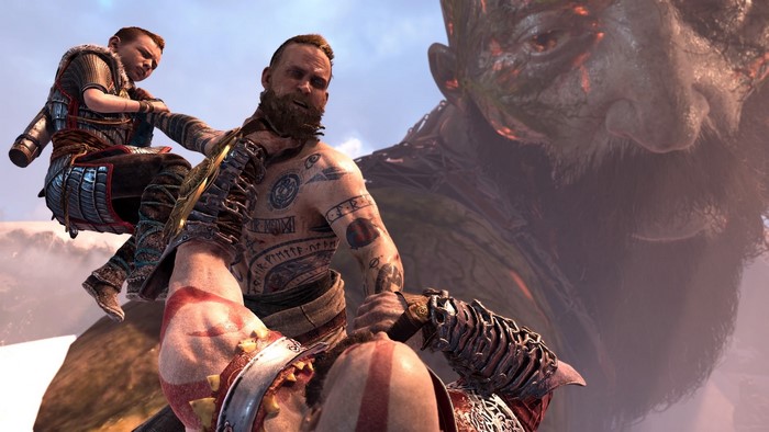 Kratos and Atreus from God of War fighting a giant