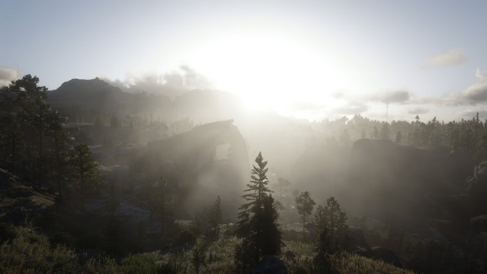 Red Dead Redemption 2 landscape with mountains and sun
