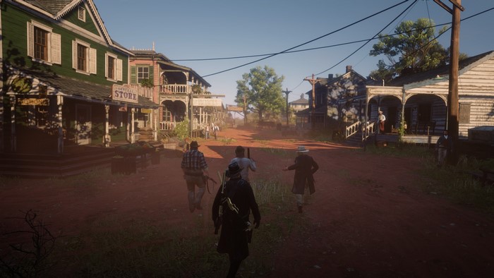 Red Dead Redemption 2 characters in a dusty town street