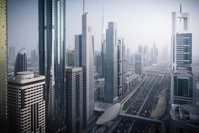 Dubai cityscape with skyscrapers and highway traffic