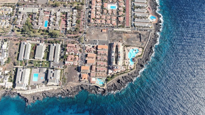 Aerial view of Tenerife coastline with resorts and ocean
