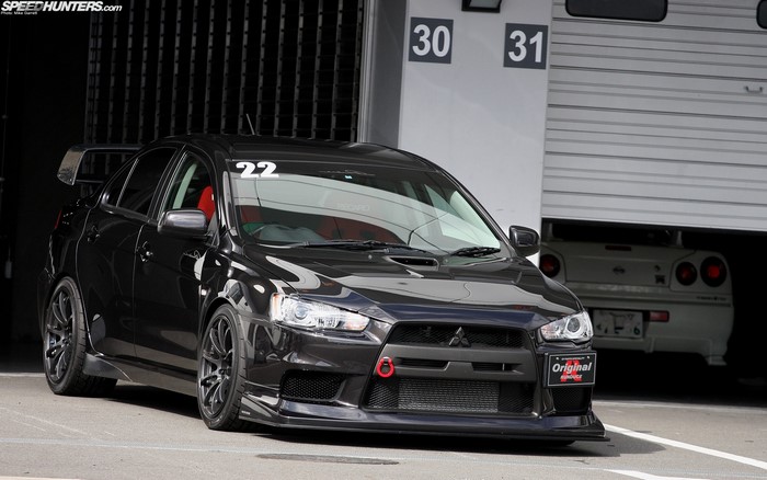 Black Mitsubishi Lancer Evo X with racing decals