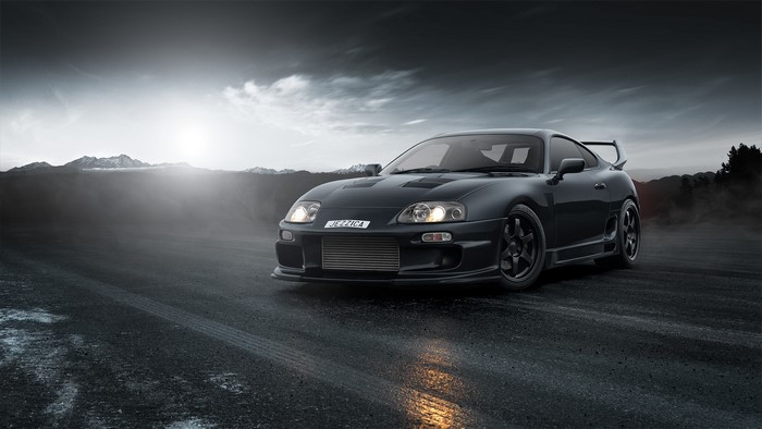 Black Toyota Supra on a wet road