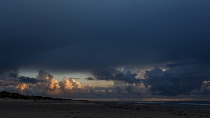 4K sunset over a cloudy beach landscape