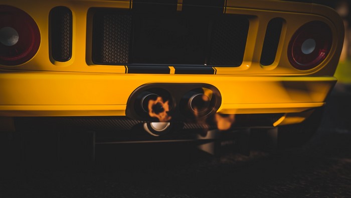 Yellow Ford GT with exhaust flare