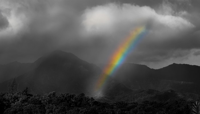 Rainbow over misty mountains in Hawaii