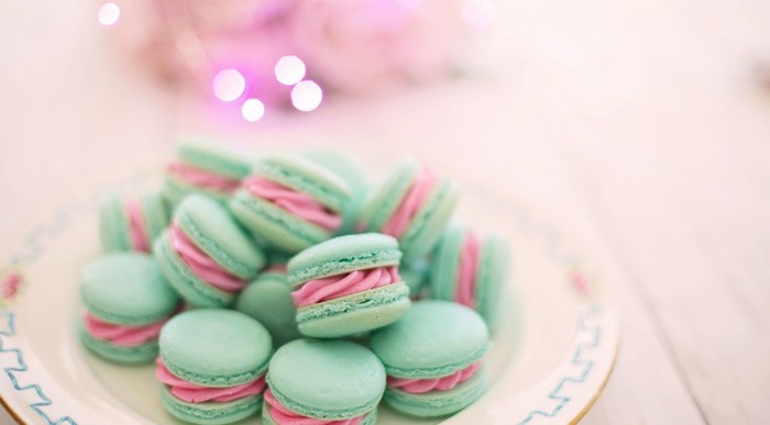 Plate of colorful macarons with pink filling