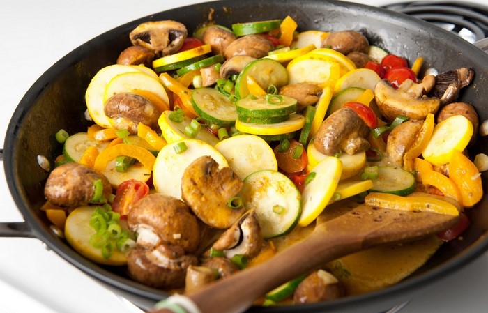 Stir-fried vegetables and mushrooms in a pan