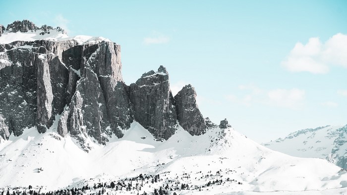 Snowy Dolomite Alps in Italy under a bright sky