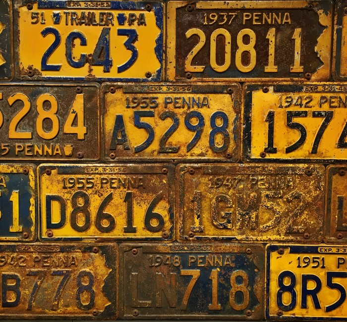 Collection of old and rusty license plates