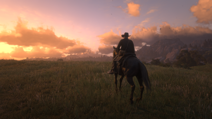 Arthur Morgan riding a horse at sunset