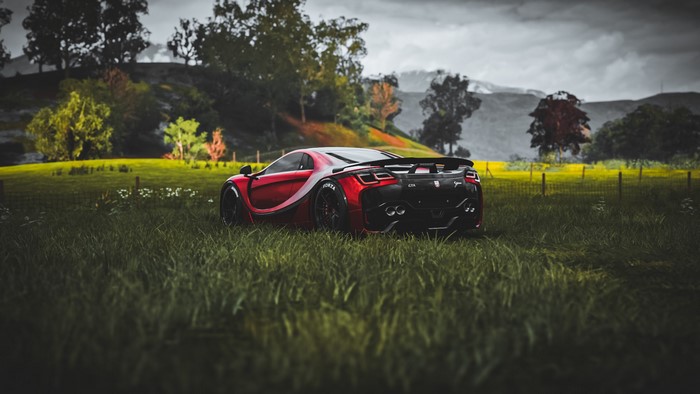 GTA Spano car in a grassy field