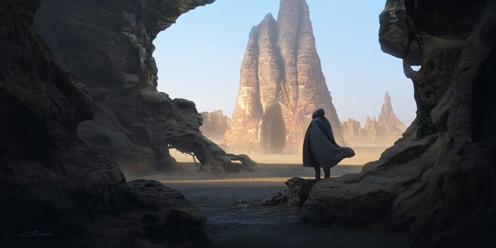 Figure in a cloak before a colossal rock formation